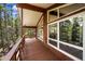 Expansive balcony with panoramic views of the surrounding tall pine trees and natural landscape at 542 Harris Dr, Idaho Springs, CO 80452