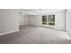 Spacious carpeted basement with large window views of mature trees at 542 Harris Dr, Idaho Springs, CO 80452