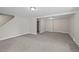 Spacious basement with neutral carpet, gray walls, and access to a bathroom at 542 Harris Dr, Idaho Springs, CO 80452