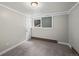 Cozy bedroom with neutral gray walls, carpet and one window at 542 Harris Dr, Idaho Springs, CO 80452