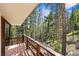 Wooden deck with forest views offering an ideal spot to enjoy nature and relax at 542 Harris Dr, Idaho Springs, CO 80452