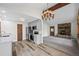 Open-concept kitchen flows into living area, featuring modern appliances and ample counter space at 542 Harris Dr, Idaho Springs, CO 80452