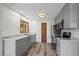 Bright kitchen features gray cabinets, marbled countertops, and sleek stainless steel appliances at 542 Harris Dr, Idaho Springs, CO 80452