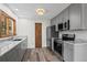 Stylish kitchen featuring stainless steel appliances, sleek countertops, and plenty of cabinet space at 542 Harris Dr, Idaho Springs, CO 80452