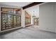 Bright living room boasting large windows with scenic views, complemented by vaulted ceilings and wood beams at 542 Harris Dr, Idaho Springs, CO 80452
