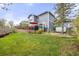 Spacious backyard showcasing a deck with pergola, lush lawn, and hot tub area for outdoor enjoyment at 907 Eldorado Dr, Superior, CO 80027