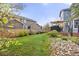 Lush green backyard featuring a deck, privacy fence and landscaped areas for outdoor enjoyment at 907 Eldorado Dr, Superior, CO 80027