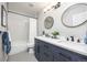 Bathroom featuring double sinks, modern vanity, new fixtures, tile flooring, and tiled shower/tub at 907 Eldorado Dr, Superior, CO 80027