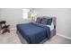 Well-lit bedroom features a comfortable queen size bed, plush carpet, and neutral paint at 907 Eldorado Dr, Superior, CO 80027