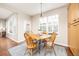 Cozy breakfast nook with a round wooden table, four chairs, and a window with natural light at 907 Eldorado Dr, Superior, CO 80027