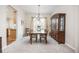 Bright dining room featuring a chandelier, a large window, and ample space for entertaining at 907 Eldorado Dr, Superior, CO 80027