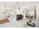 Open-concept living and dining area with vaulted ceilings, staircase, and lots of natural light at 907 Eldorado Dr, Superior, CO 80027