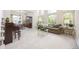 Bright, spacious living room with tall windows and plush carpeting, perfect for Gathering gatherings at 907 Eldorado Dr, Superior, CO 80027