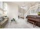 Inviting living room with plush carpeting, grand staircase, large windows, and lots of natural light at 907 Eldorado Dr, Superior, CO 80027
