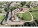 Stunning aerial view of the golf course and clubhouse with luxurious amenities and lush green fairways at 8033 Galileo Way, Littleton, CO 80125
