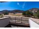Scenic view from deck features manicured golf course and mountain backdrop at 8033 Galileo Way, Littleton, CO 80125