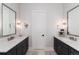 Bright bathroom features double vanity, white marble countertops, and modern fixtures at 8033 Galileo Way, Littleton, CO 80125