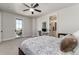 Bright bedroom with a walkout balcony and an ensuite bathroom at 8033 Galileo Way, Littleton, CO 80125
