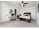 Cozy bedroom with a ceiling fan, desk and a comfortable bed at 8033 Galileo Way, Littleton, CO 80125