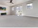 Large bonus room with plush carpeting, mountain views, and a ceiling fan at 8033 Galileo Way, Littleton, CO 80125