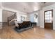 Elegant dining room with modern chandelier, hardwood floors, and staircase, ideal for entertaining at 8033 Galileo Way, Littleton, CO 80125
