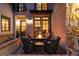 Inviting outdoor patio featuring a cozy fire pit and comfortable seating, perfect for evening relaxation at 8033 Galileo Way, Littleton, CO 80125