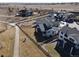 An aerial view of the home showing landscaping, fencing, and surrounding neighborhood at 804 Spyglass Cir, Louisville, CO 80027