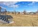 A spacious backyard features a well-maintained lawn and a wooden fence for privacy at 804 Spyglass Cir, Louisville, CO 80027