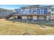 View of the home and backyard from the lawn featuring a walkout basement at 804 Spyglass Cir, Louisville, CO 80027