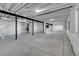Large unfinished basement with high ceilings and black support beams, ready for customization at 804 Spyglass Cir, Louisville, CO 80027