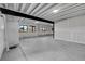 Spacious unfinished basement with ample natural light from the black-framed windows at 804 Spyglass Cir, Louisville, CO 80027