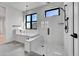 Stylish bathroom featuring a modern shower, soaking tub, and sleek fixtures at 804 Spyglass Cir, Louisville, CO 80027