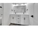 Bright bathroom featuring a dual sink vanity and sleek modern fixtures at 804 Spyglass Cir, Louisville, CO 80027