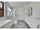 Modern bathroom featuring a glass-enclosed shower, separate tub, and dual vanity at 804 Spyglass Cir, Louisville, CO 80027