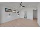 Well-lit bedroom featuring light hardwood floors and access to a bathroom at 804 Spyglass Cir, Louisville, CO 80027