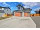 Beautiful two-story home with a three car garage and a well-maintained lawn at 804 Spyglass Cir, Louisville, CO 80027