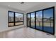 Living Area with large windows and sliding doors to a deck with neighborhood views at 804 Spyglass Cir, Louisville, CO 80027