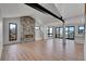 Spacious living room featuring a stone fireplace, high ceilings and lots of windows at 804 Spyglass Cir, Louisville, CO 80027