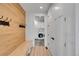 Mudroom featuring coat hooks, bench with storage, and doorway to the laundry room at 804 Spyglass Cir, Louisville, CO 80027
