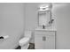 Modern powder room with a sleek vanity and toilet at 804 Spyglass Cir, Louisville, CO 80027