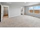 Bright bedroom with neutral carpet and access to an ensuite bathroom at 2244 Alyssa St, Fort Lupton, CO 80621