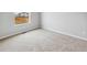 Bright bedroom features plush carpeting, neutral walls, and a large window at 2244 Alyssa St, Fort Lupton, CO 80621
