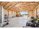 Spacious barn with exposed wood beams, concrete floor, and an open entryway at 2287 Pinto Trl, Elizabeth, CO 80107