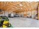 Spacious barn with exposed wooden beams and concrete floor for storage at 2287 Pinto Trl, Elizabeth, CO 80107