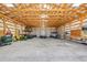 Large barn interior with high ceilings and ample space for equipment storage at 2287 Pinto Trl, Elizabeth, CO 80107
