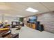 Finished basement featuring a comfortable seating area with a large screen television at 2287 Pinto Trl, Elizabeth, CO 80107