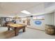 Basement rec room with a pool table and a rustic barrel decor element at 2287 Pinto Trl, Elizabeth, CO 80107