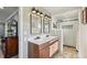 Stylish bathroom featuring double sinks, a large walk-in shower, and contemporary design at 2287 Pinto Trl, Elizabeth, CO 80107