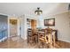 Dining area featuring hardwood floors, wood furniture, and decorative lighting at 2287 Pinto Trl, Elizabeth, CO 80107