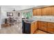 Dining area with wood floors, a sliding glass door to the deck, and wood furniture at 2287 Pinto Trl, Elizabeth, CO 80107
